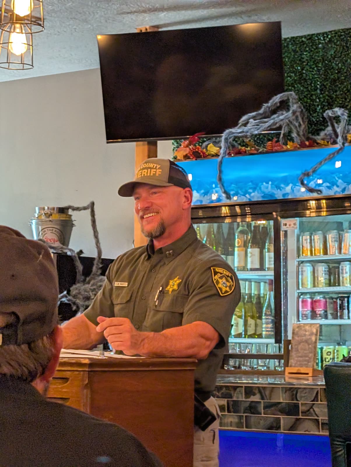 William Barry in uniform speaking with community members